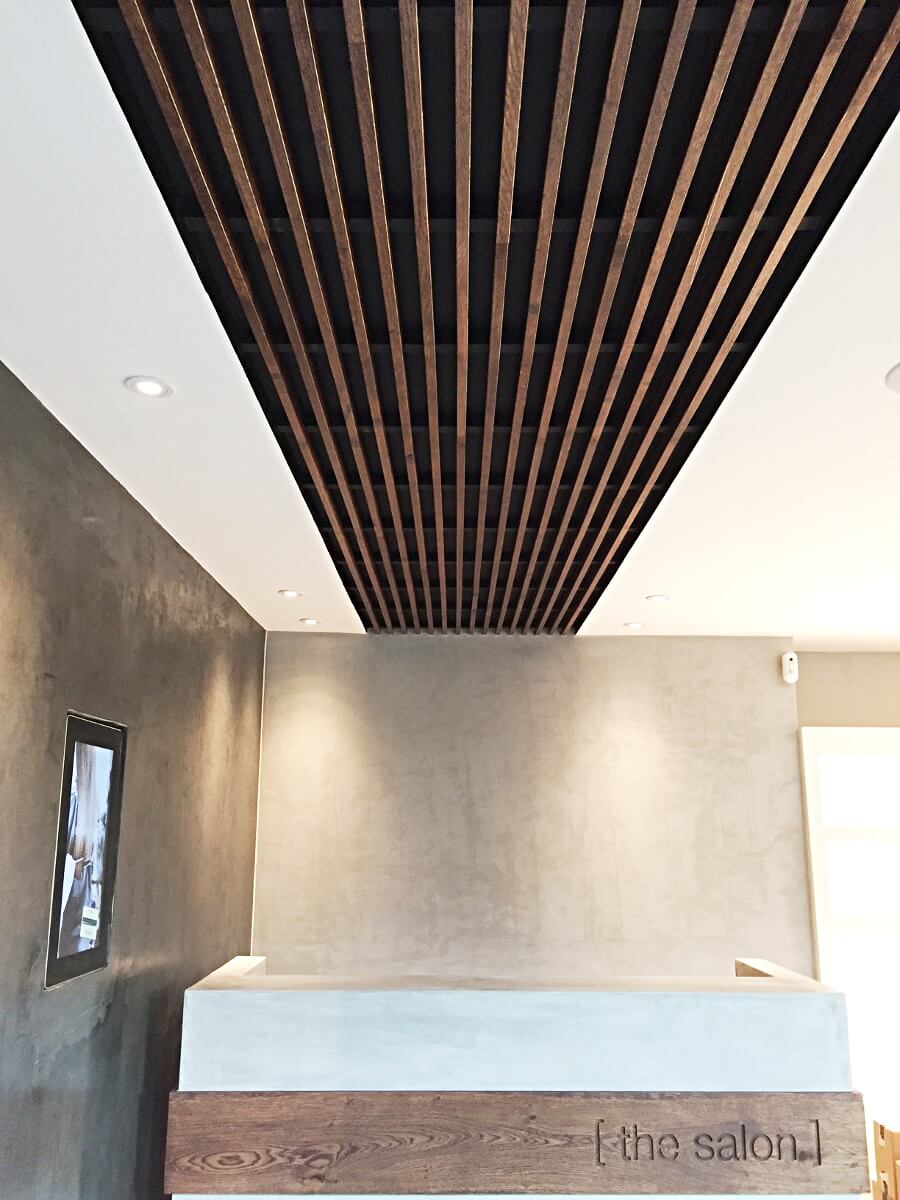 acoustic ceiling, wooden baffles, front desk, hairdresser saloon