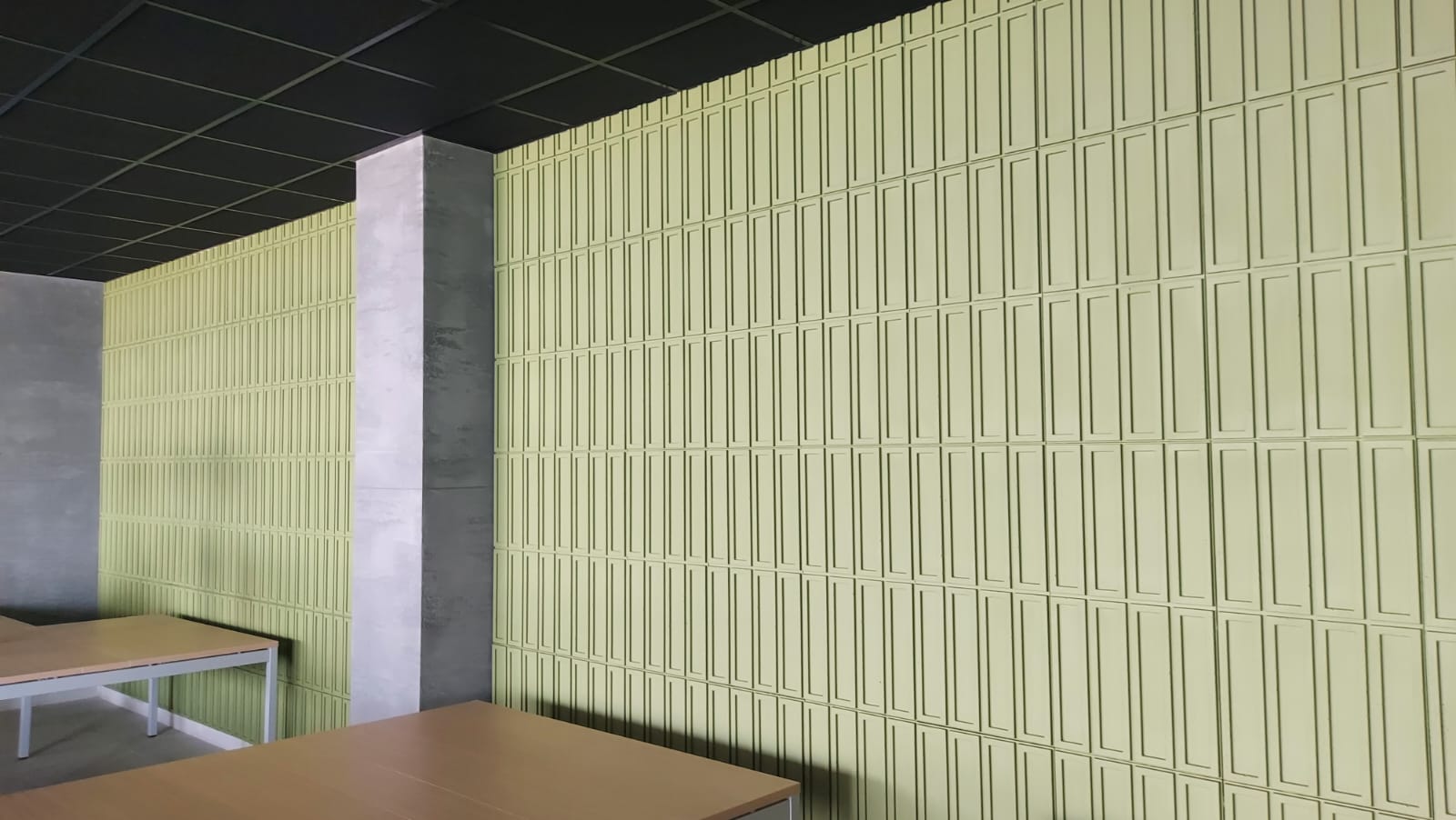green concrete panels in commercial space